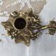 Hand-held candle holder called "cellar rat" in brass with vine leaf decoration