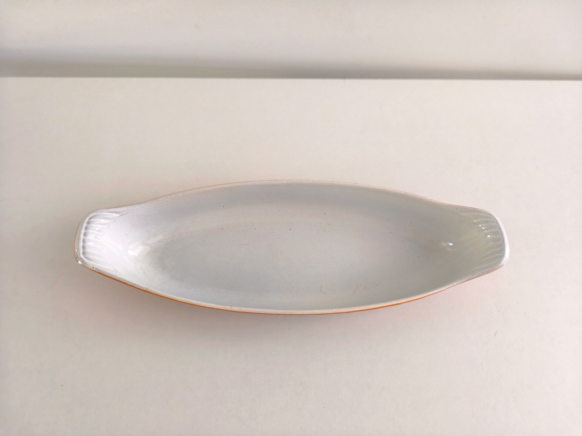 Enamelled cast iron baking dish of the Le Creuset type.