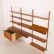 Danish teak wall unit in the style of Cadovius, Sorensen with a lamp, 1970s