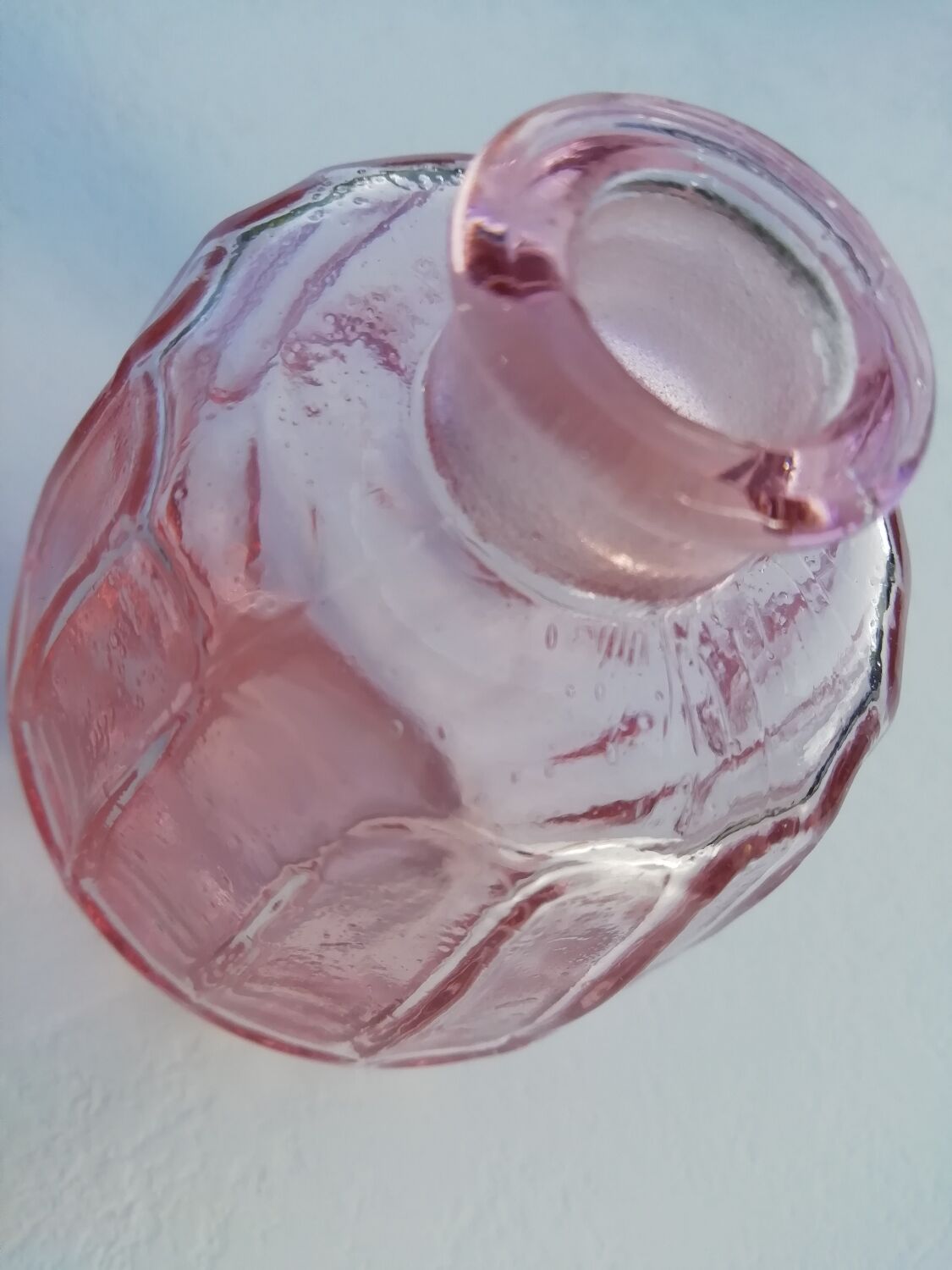 Pink molded glass bottle