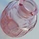 Pink molded glass bottle