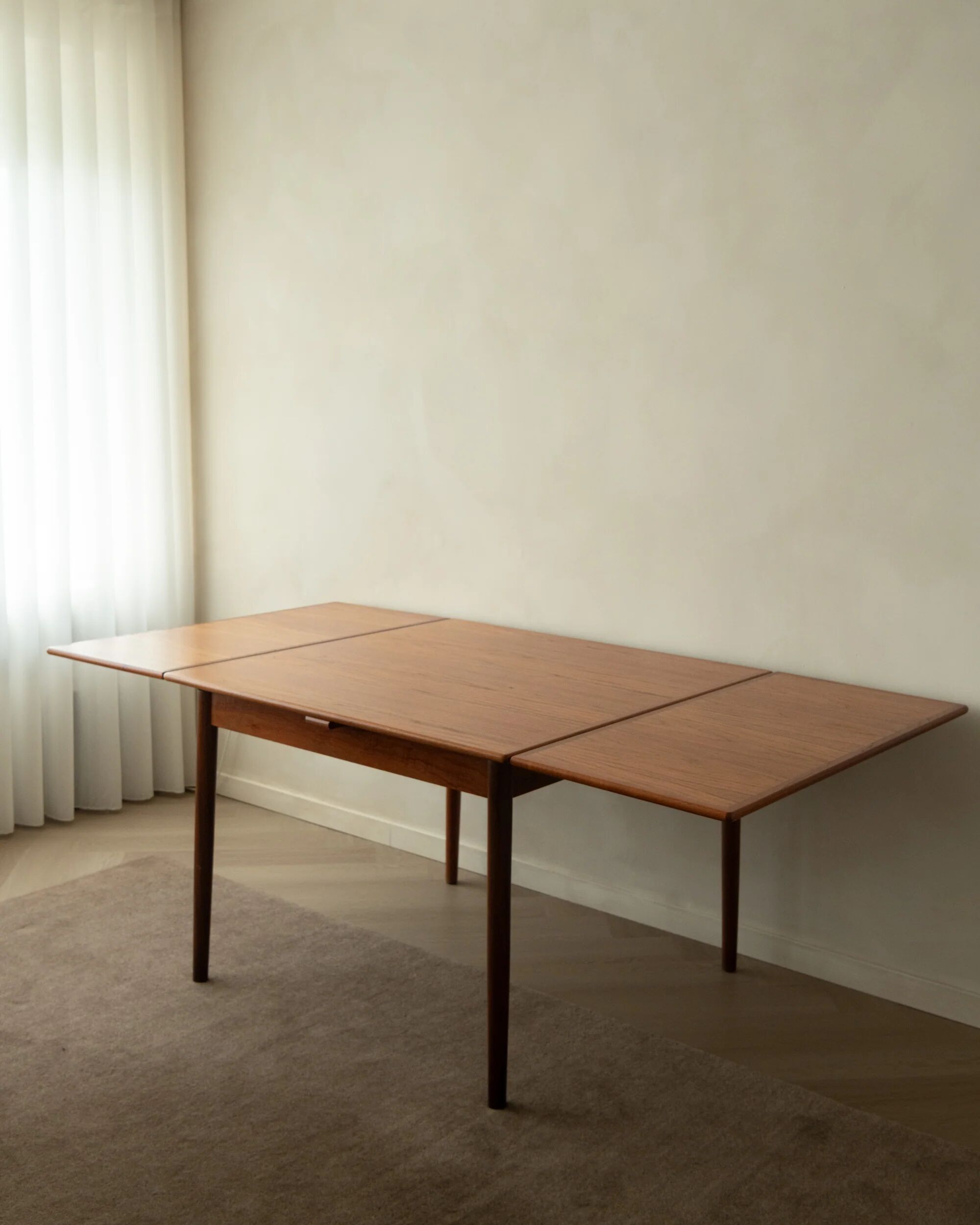 Danish modern teak extendable dining table model 24 by Ansager Møbler 1960s