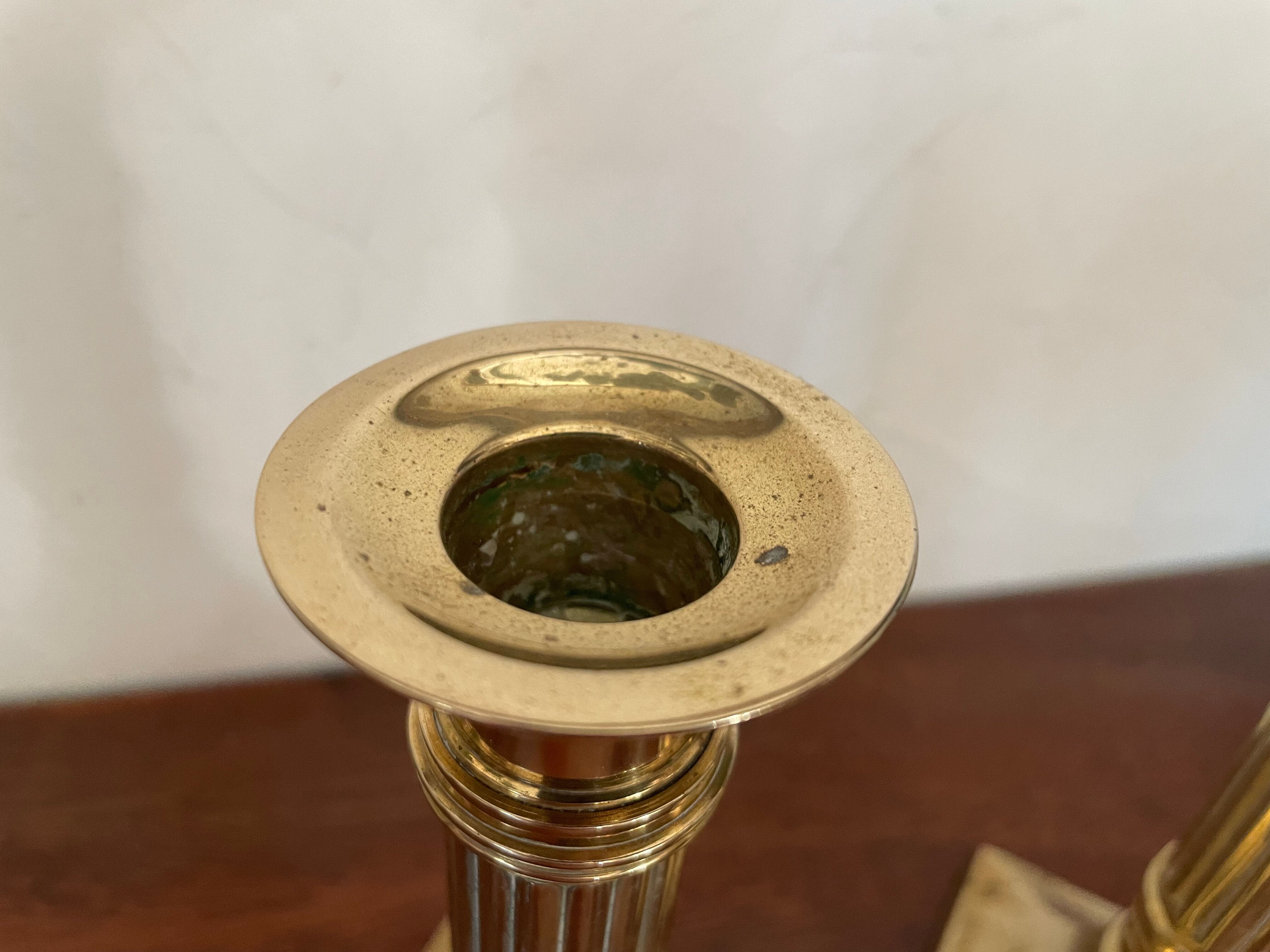 Pair of brass column candle holders