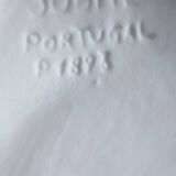 Footed dessert plate in barbotine porcelain, marked FG.