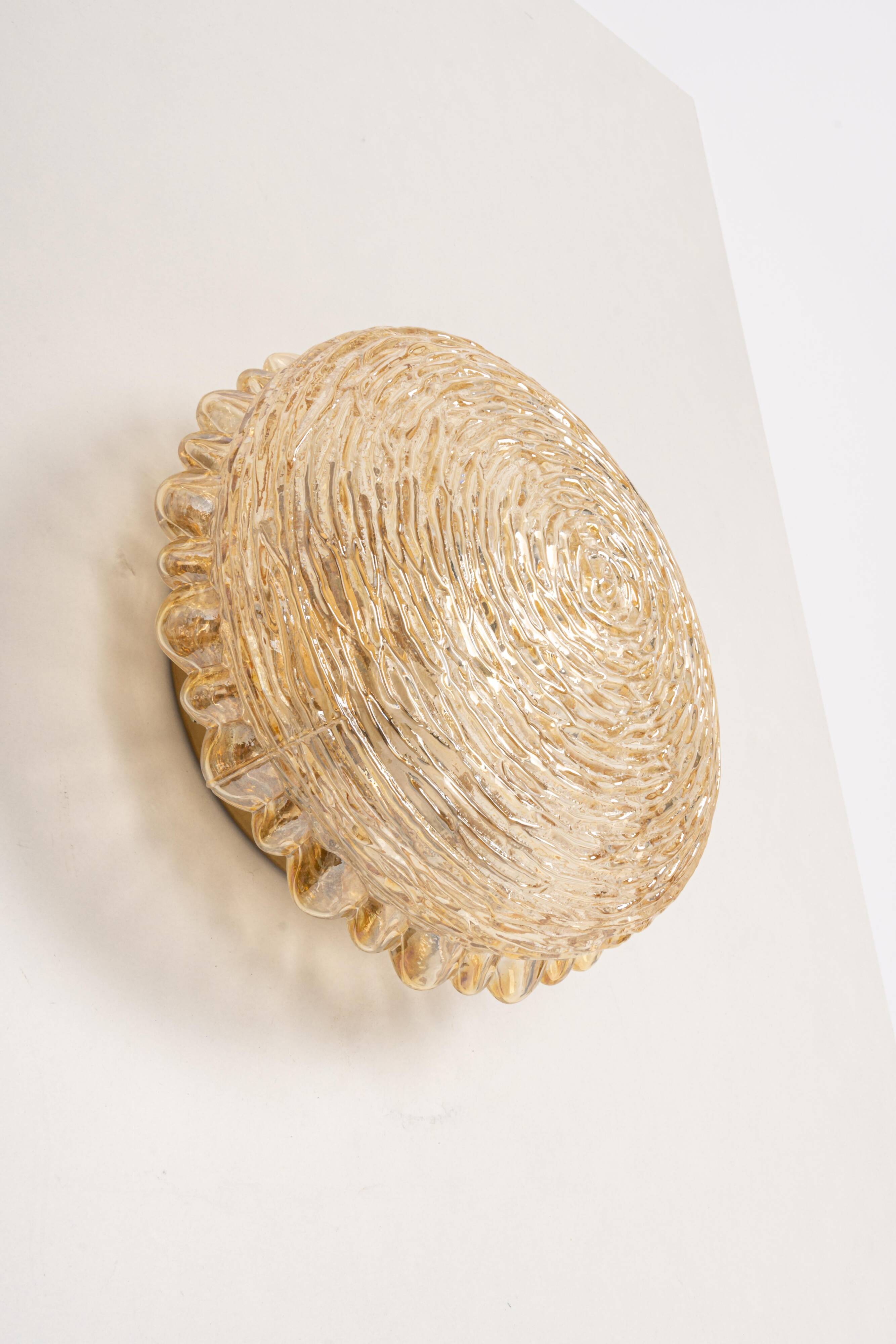 Amber glass wall sconces in the shape of a fingerprint, Germany, 1970s.