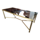 Coffee table in gilded brass and glass top