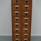 German Oak Apothecary Cabinet with Enamel Shields, 1940s