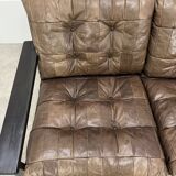 Living room sofa and brutalist armchairs in leather and wood, 70s, chalet style