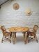Vintage Audoux Minet bamboo, rattan, and smoked glass table duo.