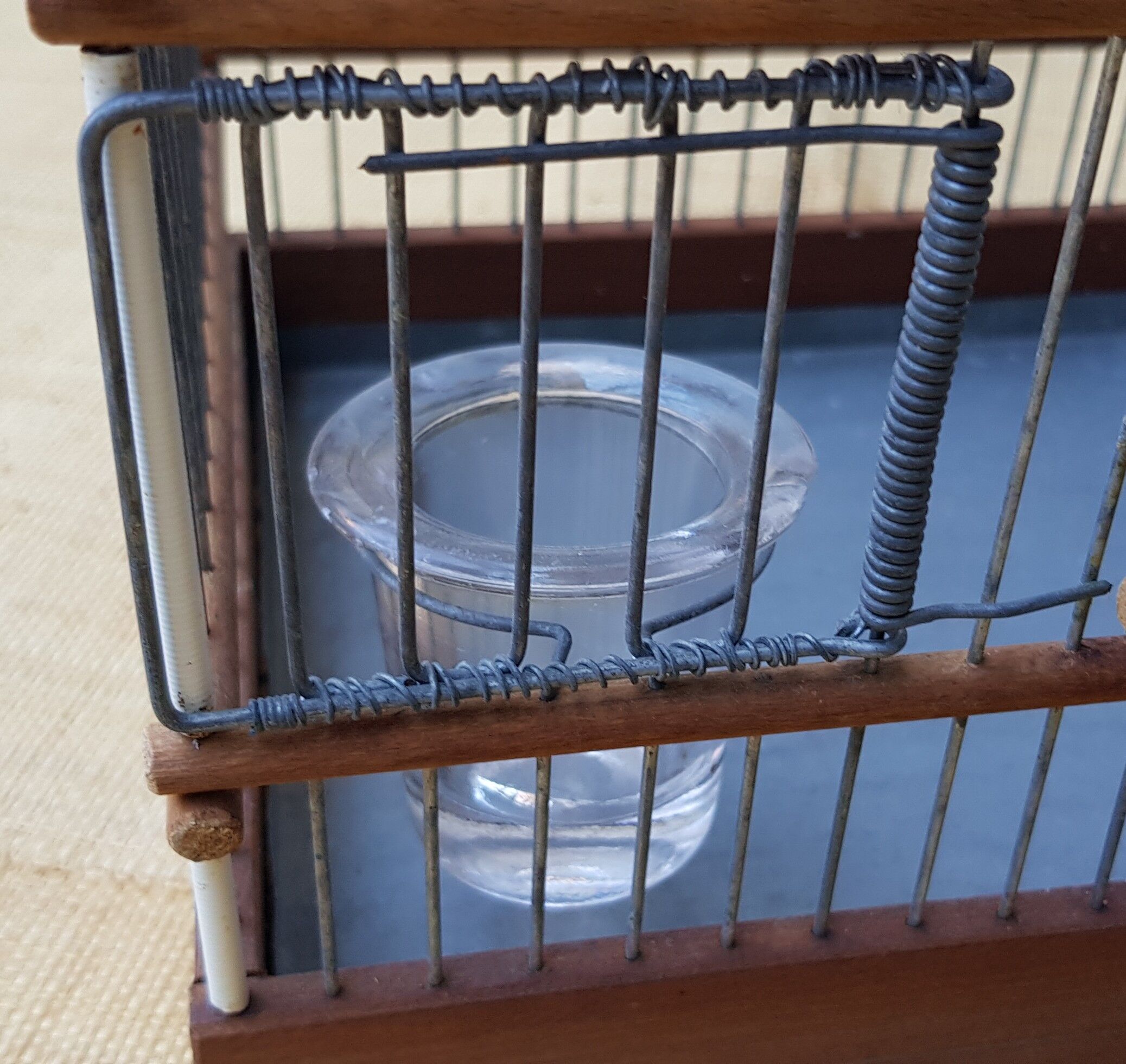 Birdcage with glass trough
