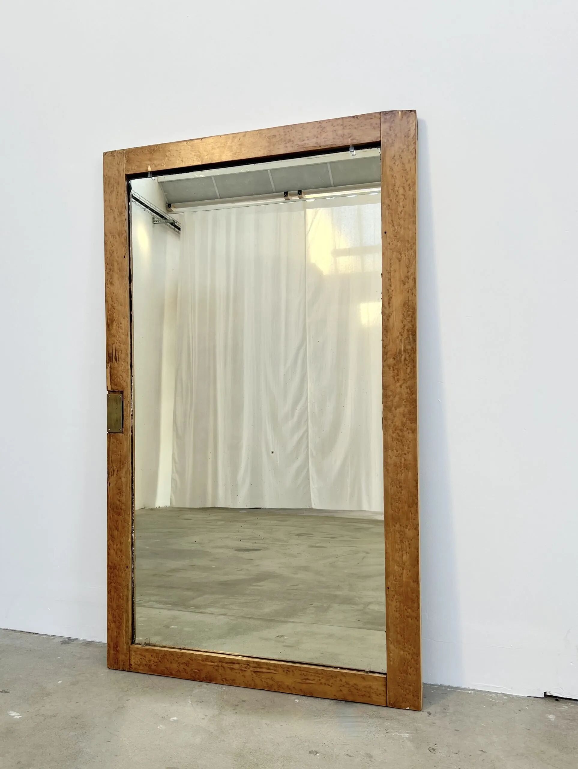 Antique mirror on an elm wardrobe door