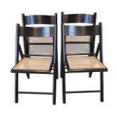 black wooden folding chairs and sitting in cannage