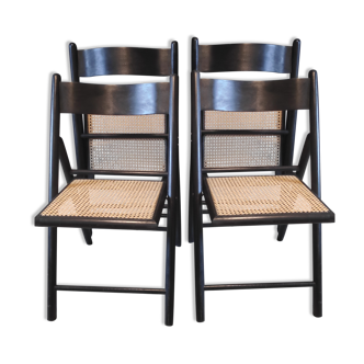 black wooden folding chairs and sitting in cannage
