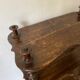 Old shelf in turned wood like reels