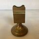 Antique brass match holder with tulip base.
