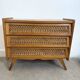 Vintage commode with tapered legs in rattan.