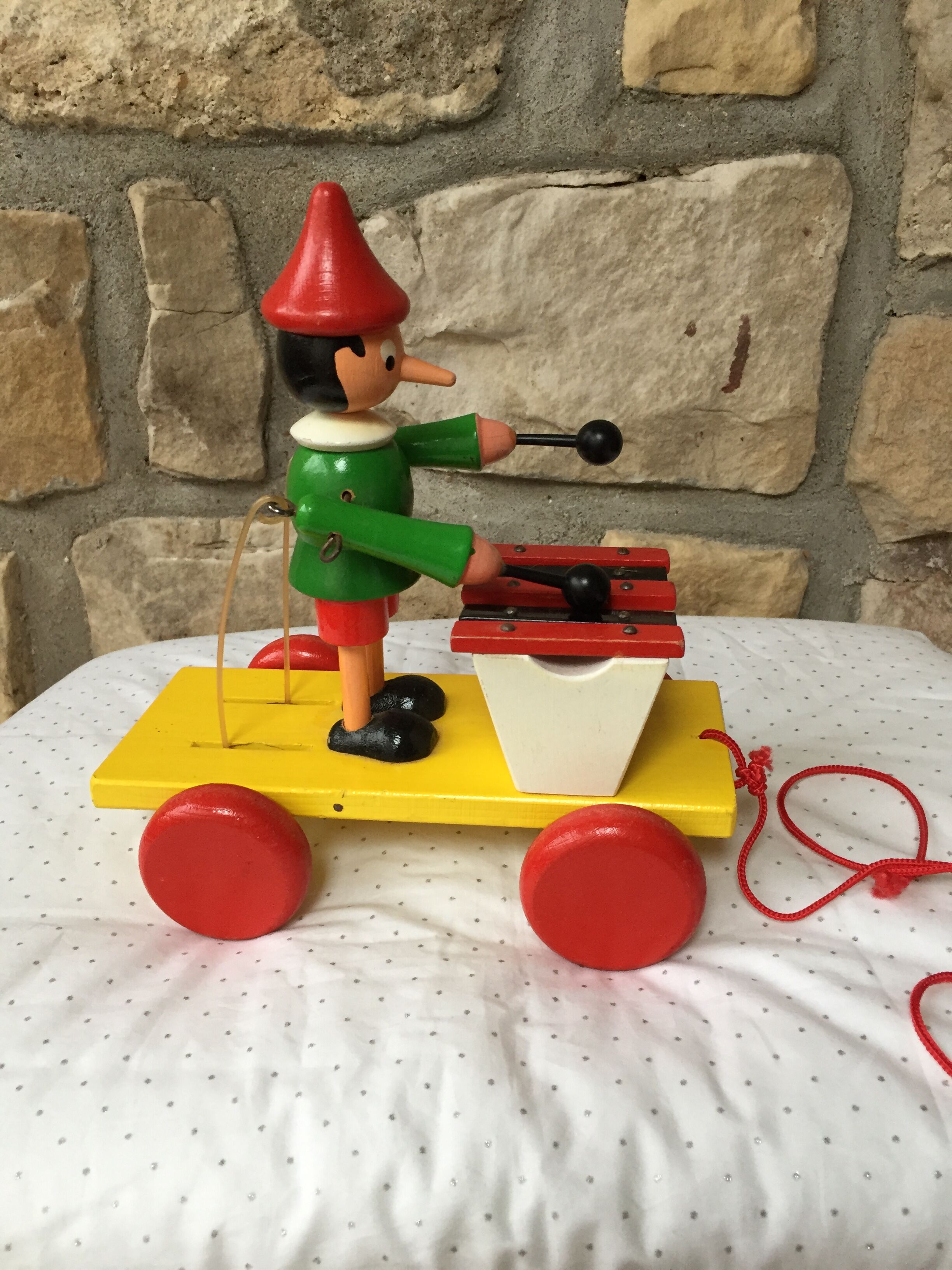 Old toy to pull Pinocchio and his xylophone
