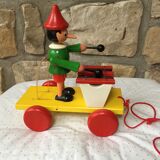Old toy to pull Pinocchio and his xylophone