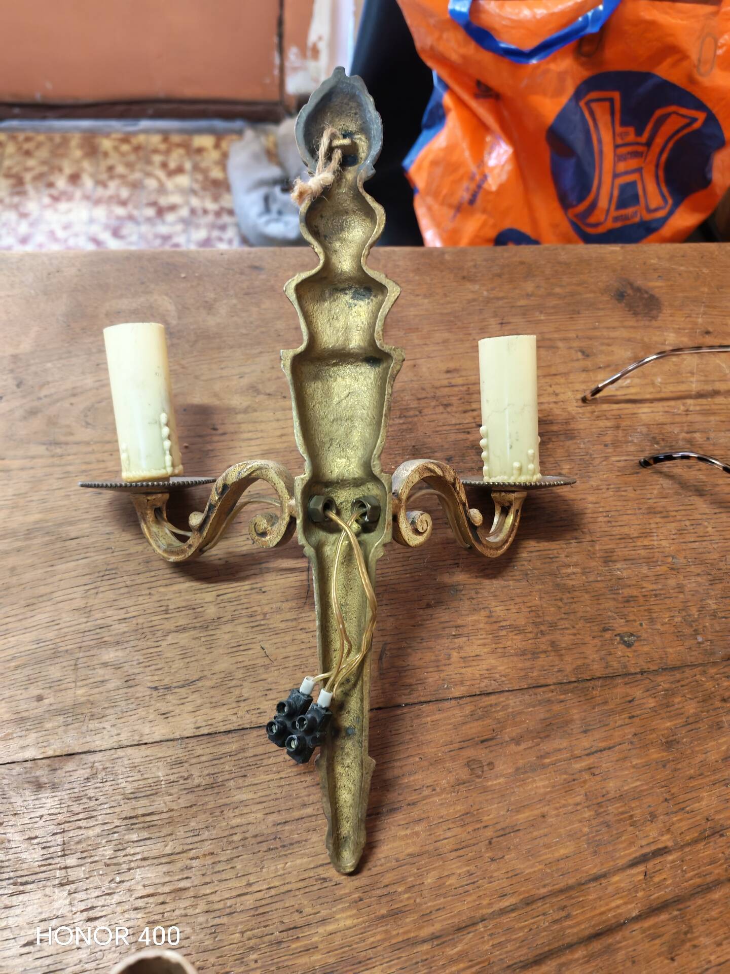 Two antique wall sconces in gilded bronze in the Louis XVI style.