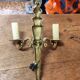 Two antique wall sconces in gilded bronze in the Louis XVI style.