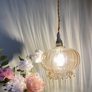Suspension globe vintage en verre ambré