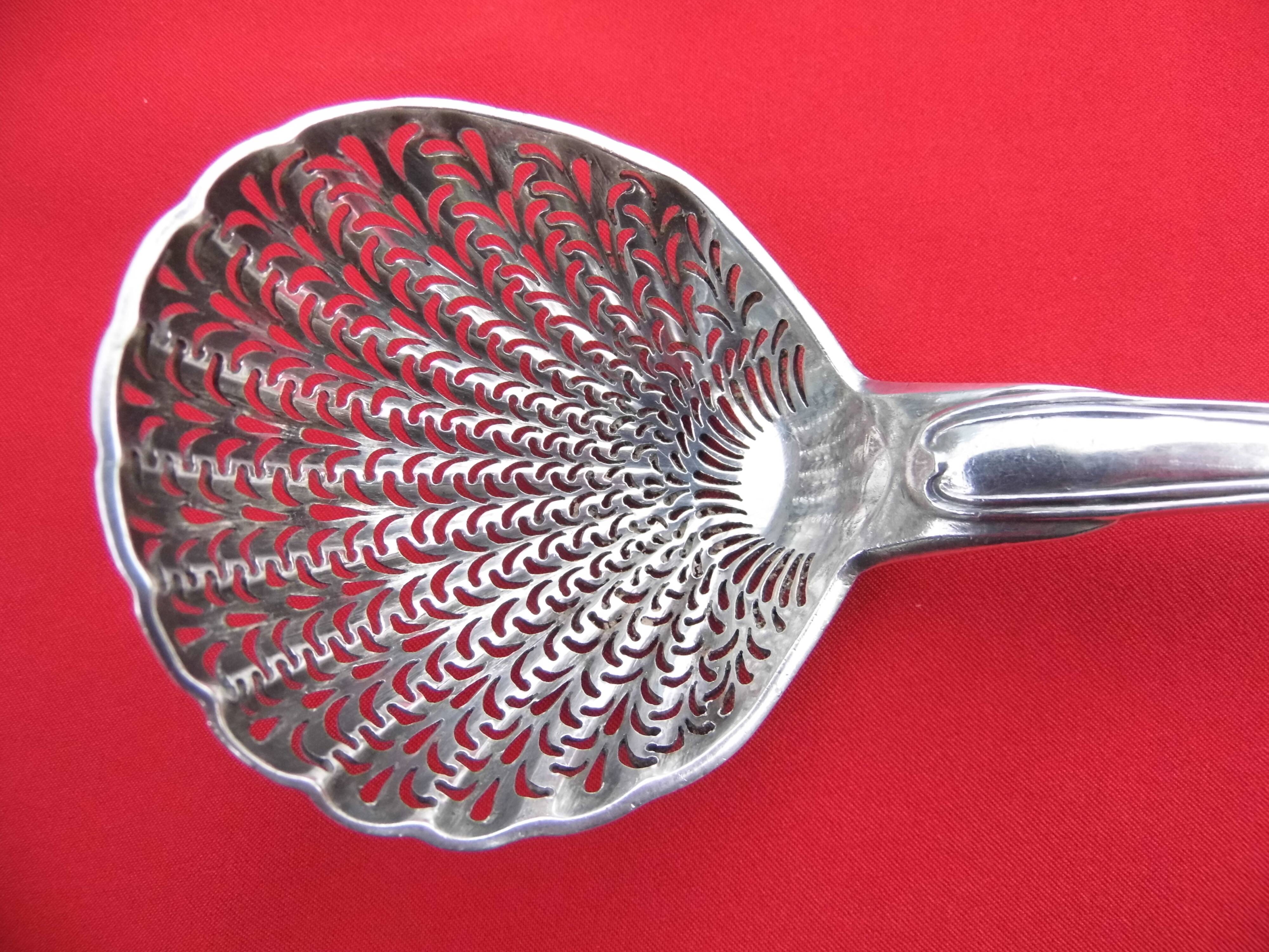 Sugar spoon, sprinkler, solid silver rooster punch, early nineteenth century