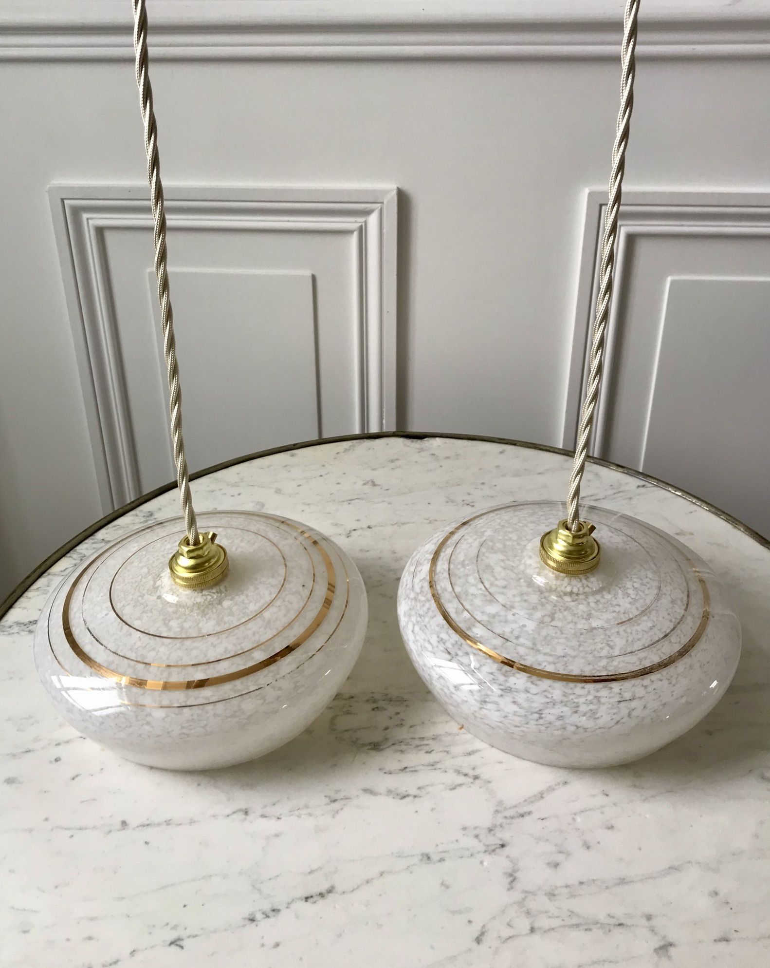 Pair of suspensions in white Clichy glass and golden edging 40s-50s