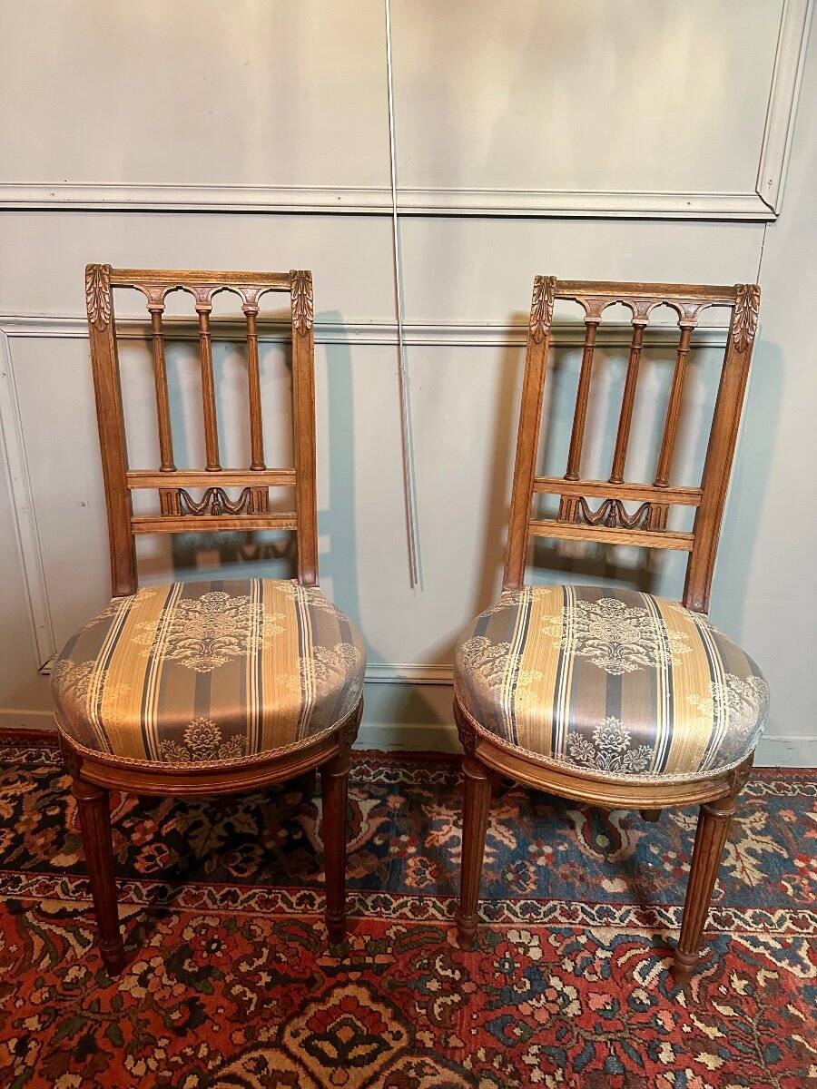 Pair Of Louis XVI Style Chairs In Walnut.