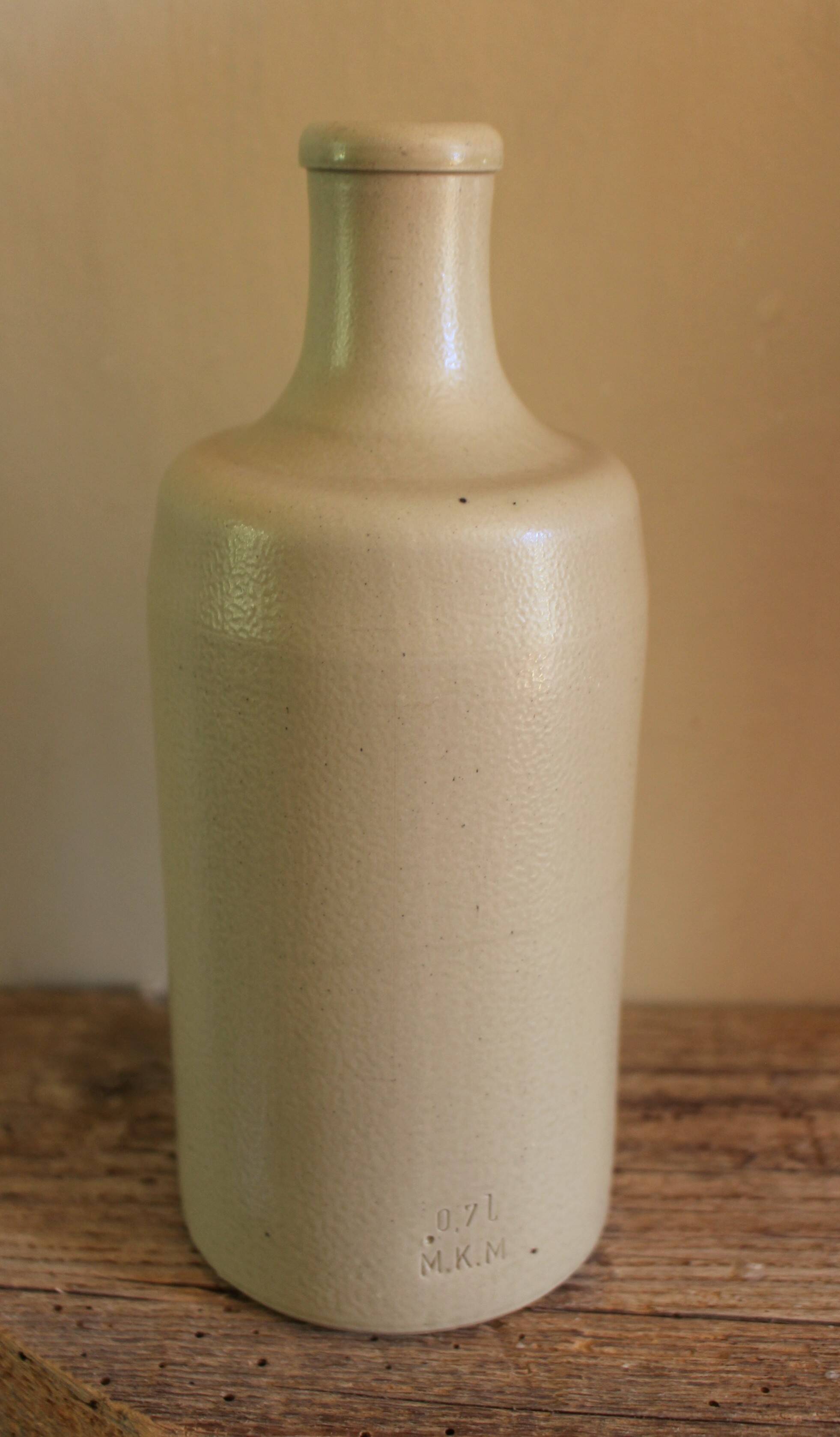 Vintage light stoneware liqueur bottle