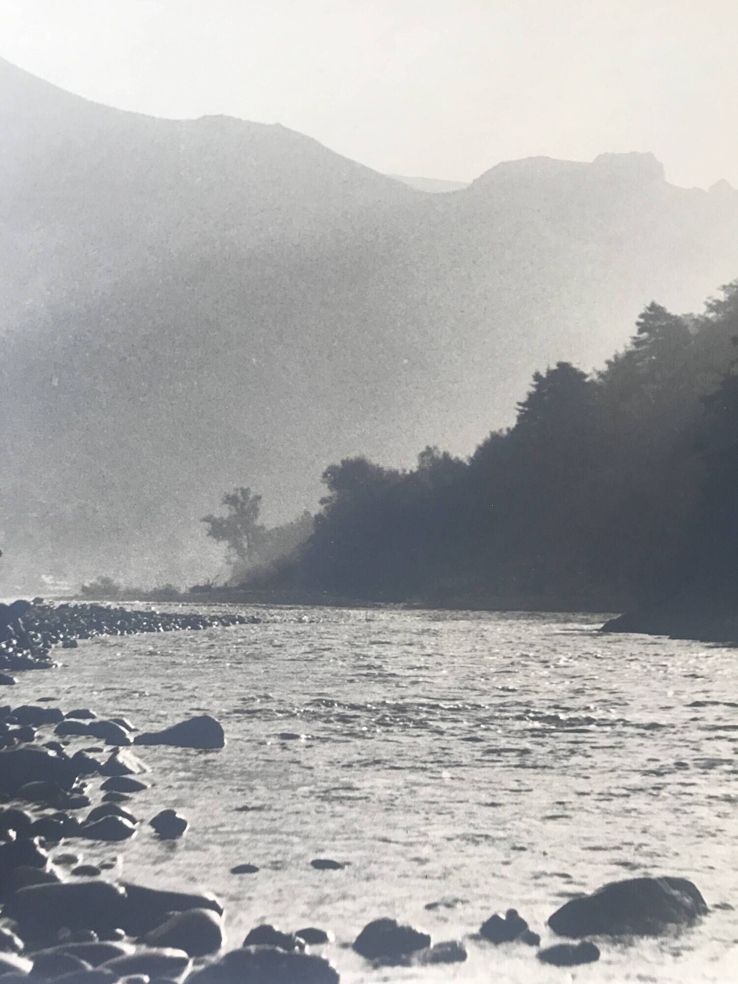 River landscape with characters, 60s/70s. Black and white silver print.
