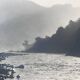River landscape with characters, 60s/70s. Black and white silver print.