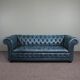 Chesterfield sofa buttoned in blue cowhide, 2.5 seats