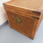 Vintage trunk in wood, rattan, caning, and brass.