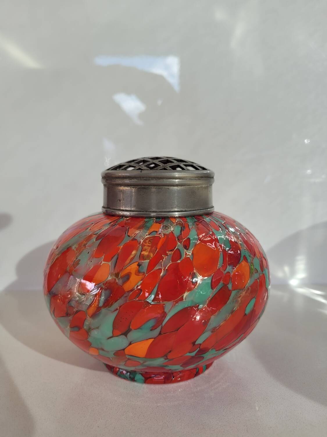 Old multi-colored glass flower vase