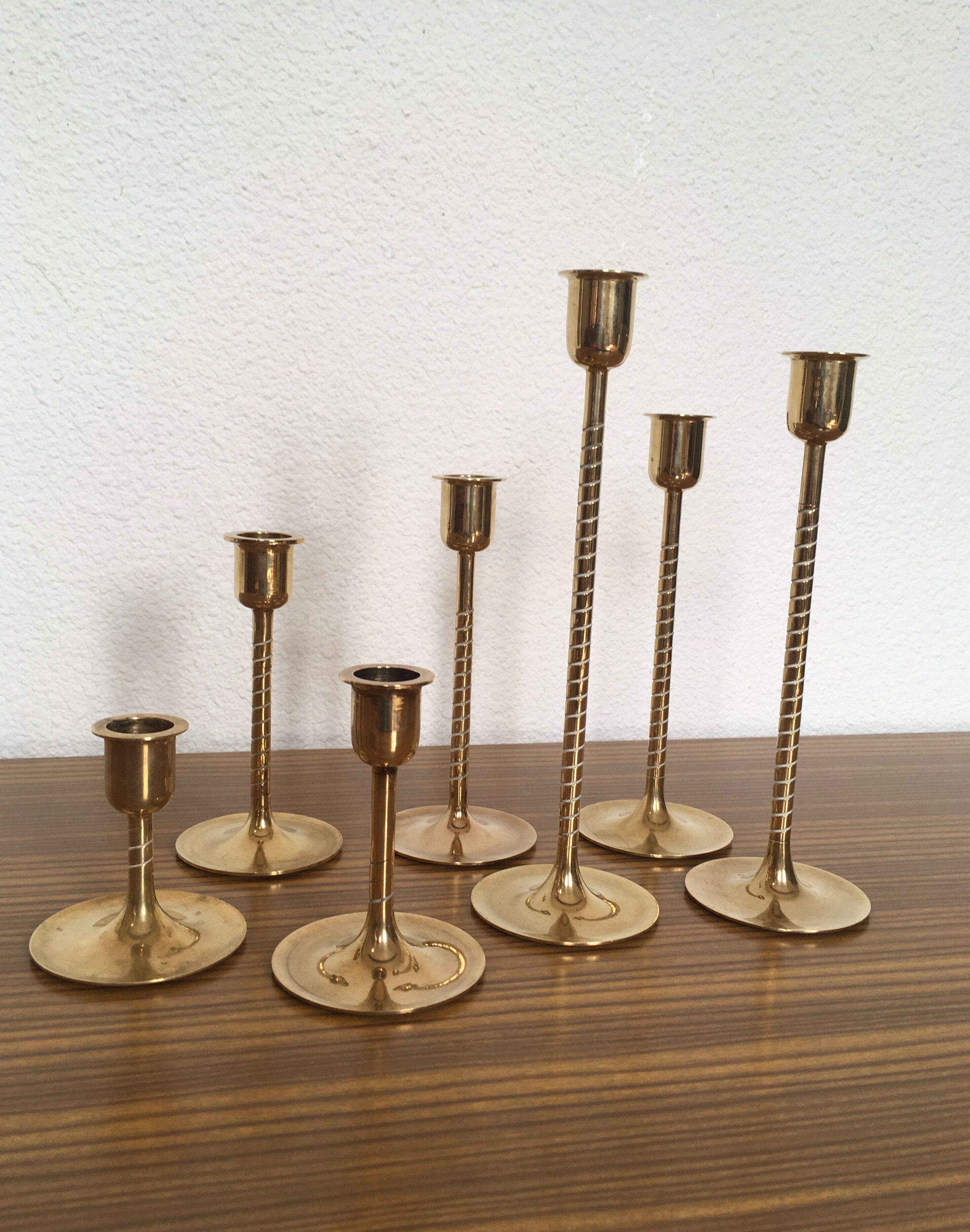 Series of 7 Scandinavian brass candlesticks