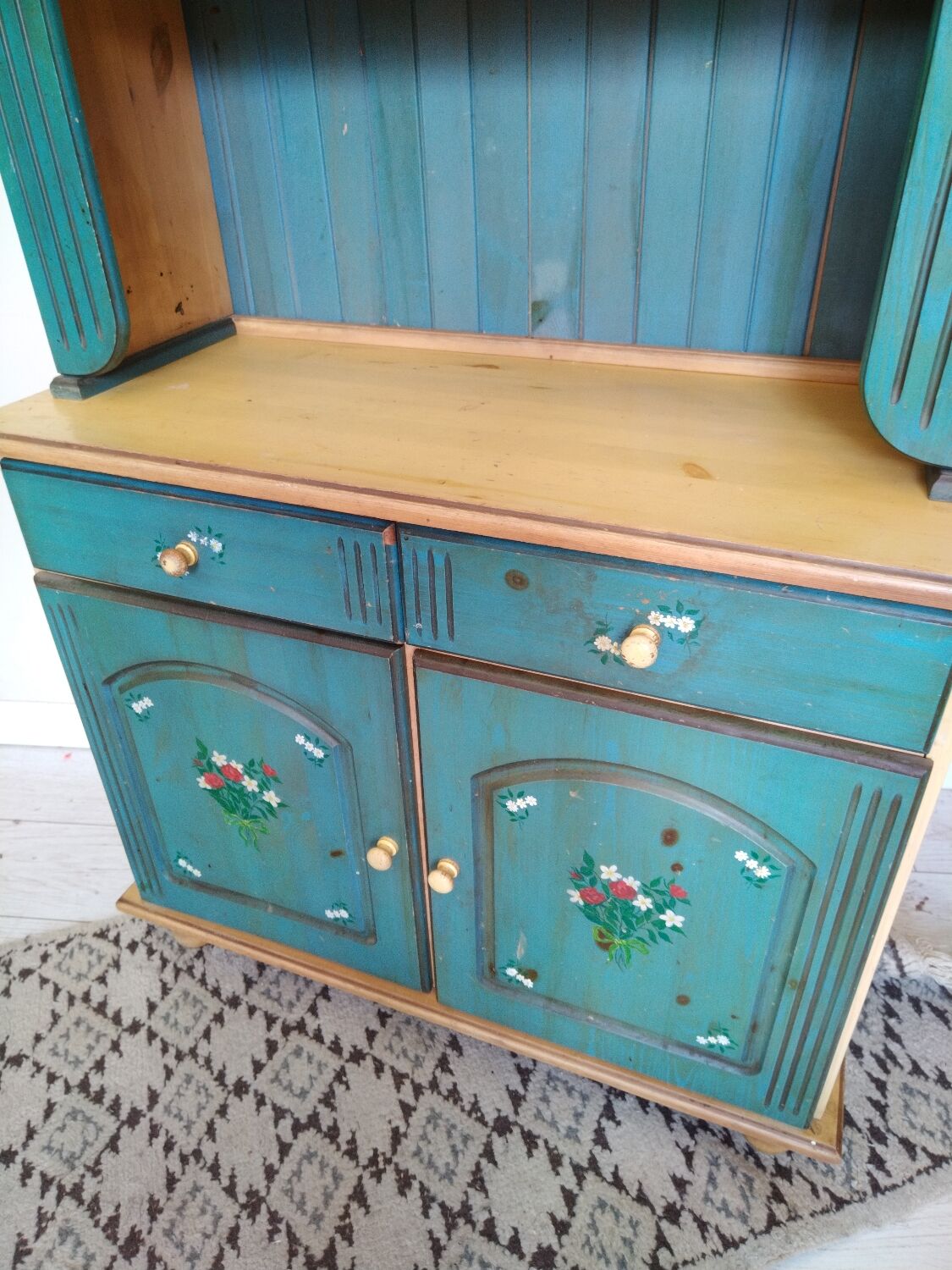 Rustic dresser with floral decor