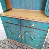 Rustic dresser with floral decor
