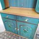 Rustic dresser with floral decor