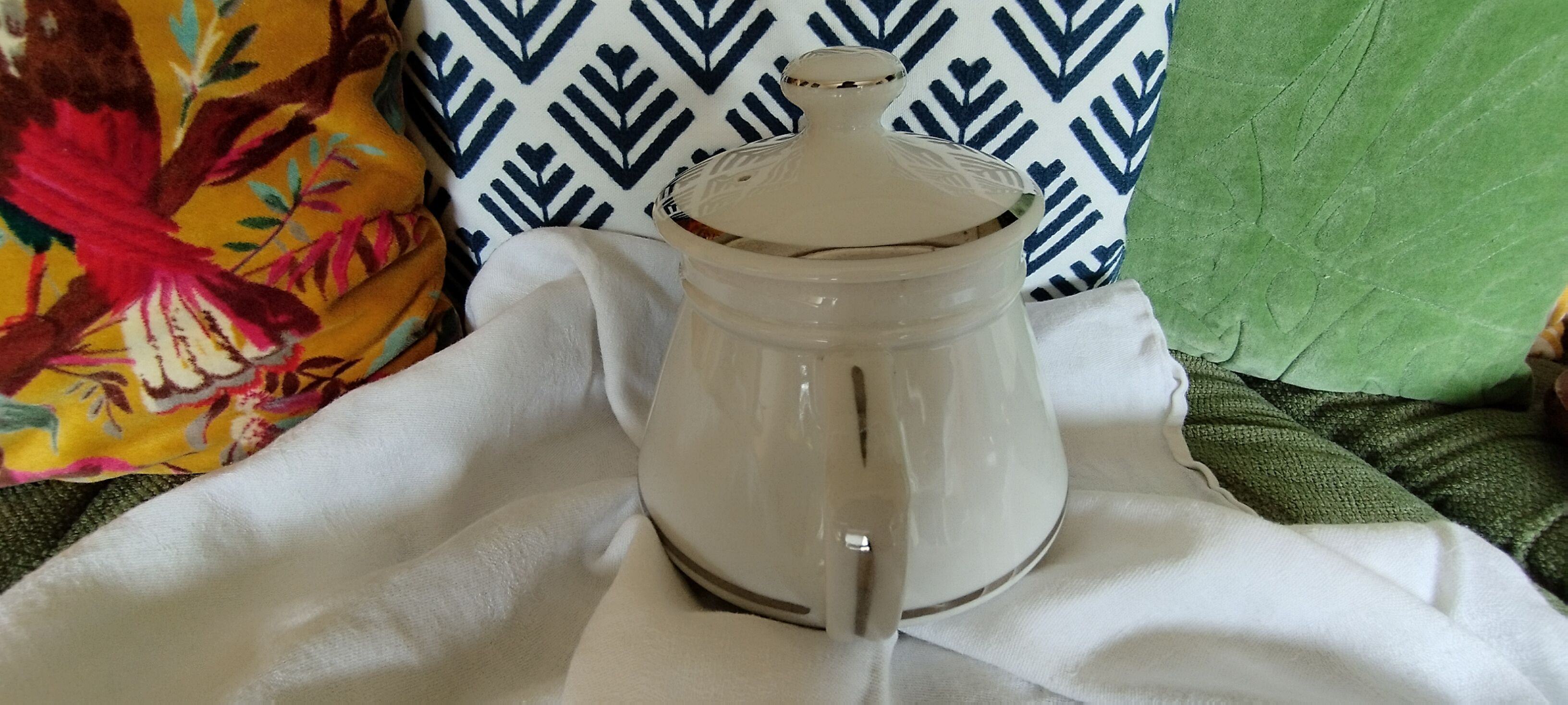 White and silver porcelain teapot