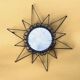 Old wrought metal sun mirror