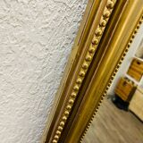 Antique gilded mirror in old Louis Philippe wood