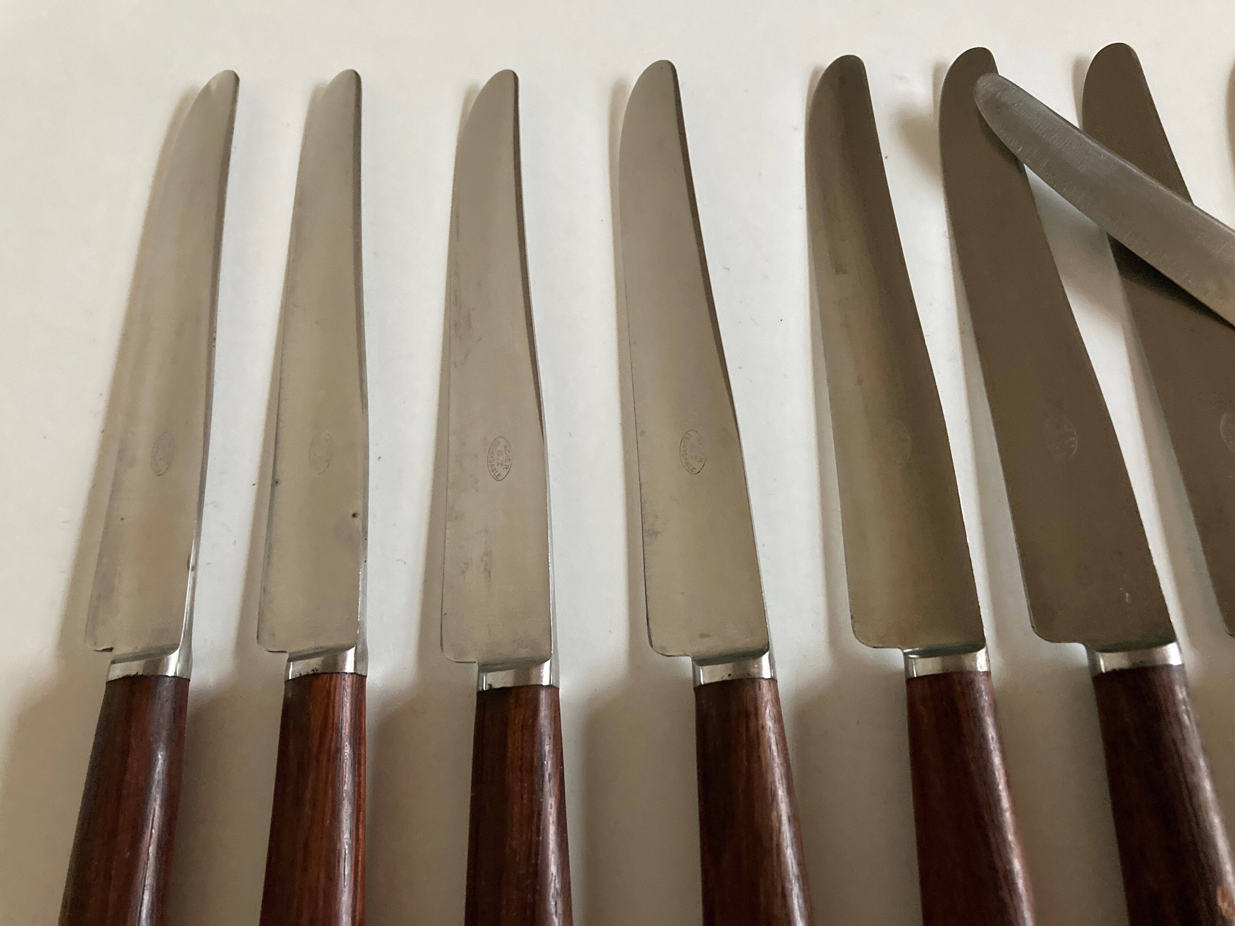 Set of 9 knives with mid century rosewood handle