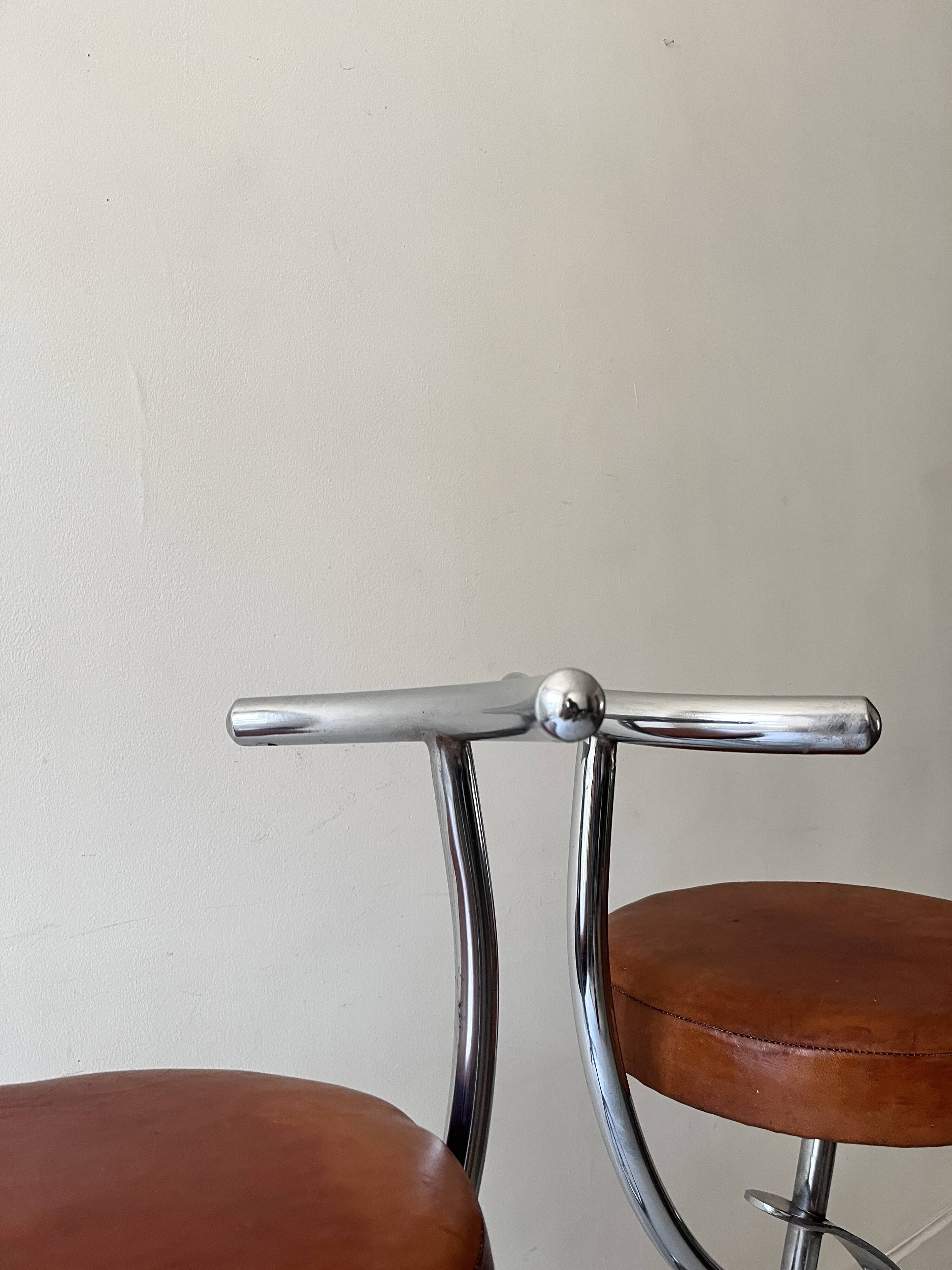 Bar stools in tubular chrome and tan leather, 1970s