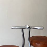 Bar stools in tubular chrome and tan leather, 1970s