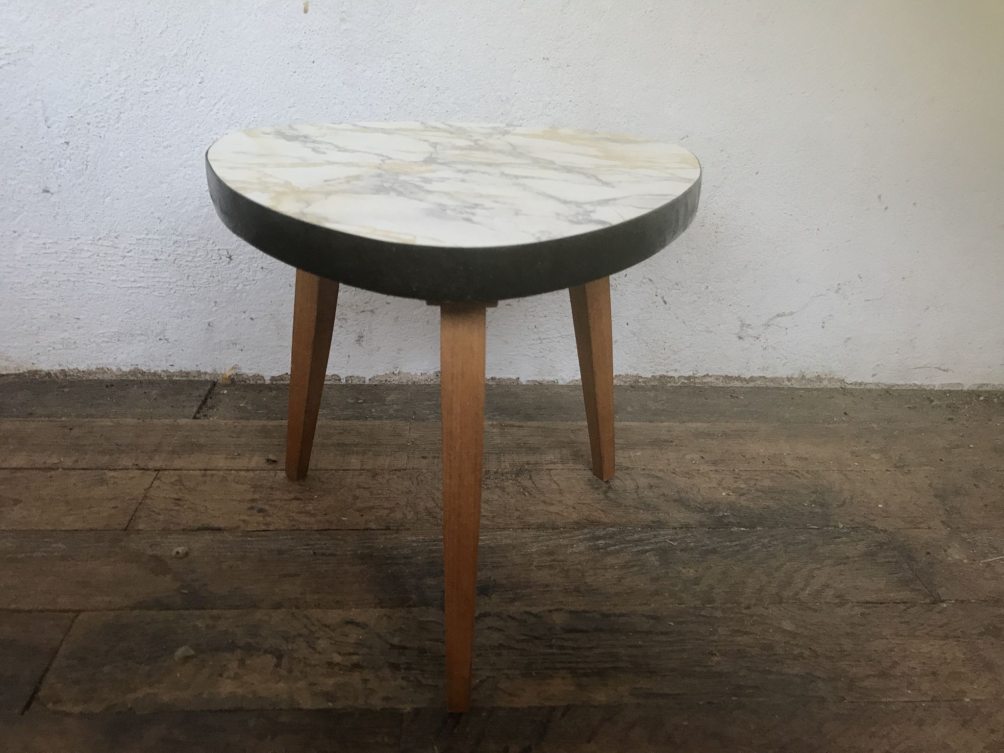 Small triangular table coffee table with a vintage tripod door midcentury plant 1950