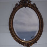 Miroir 19 ème bois et stuk doré ovale 97x62cm