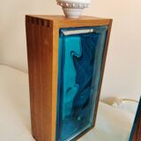 Two Swedish table lamps in solid pressed blue glass and teak wood "frame".