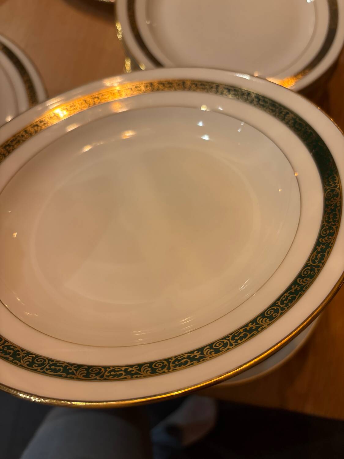 Complete old service in green and gold Limoges porcelain.