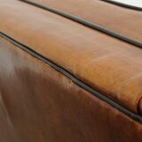 Set of 2 very comfortable large sheepskin armchairs elegantly finished with black piping