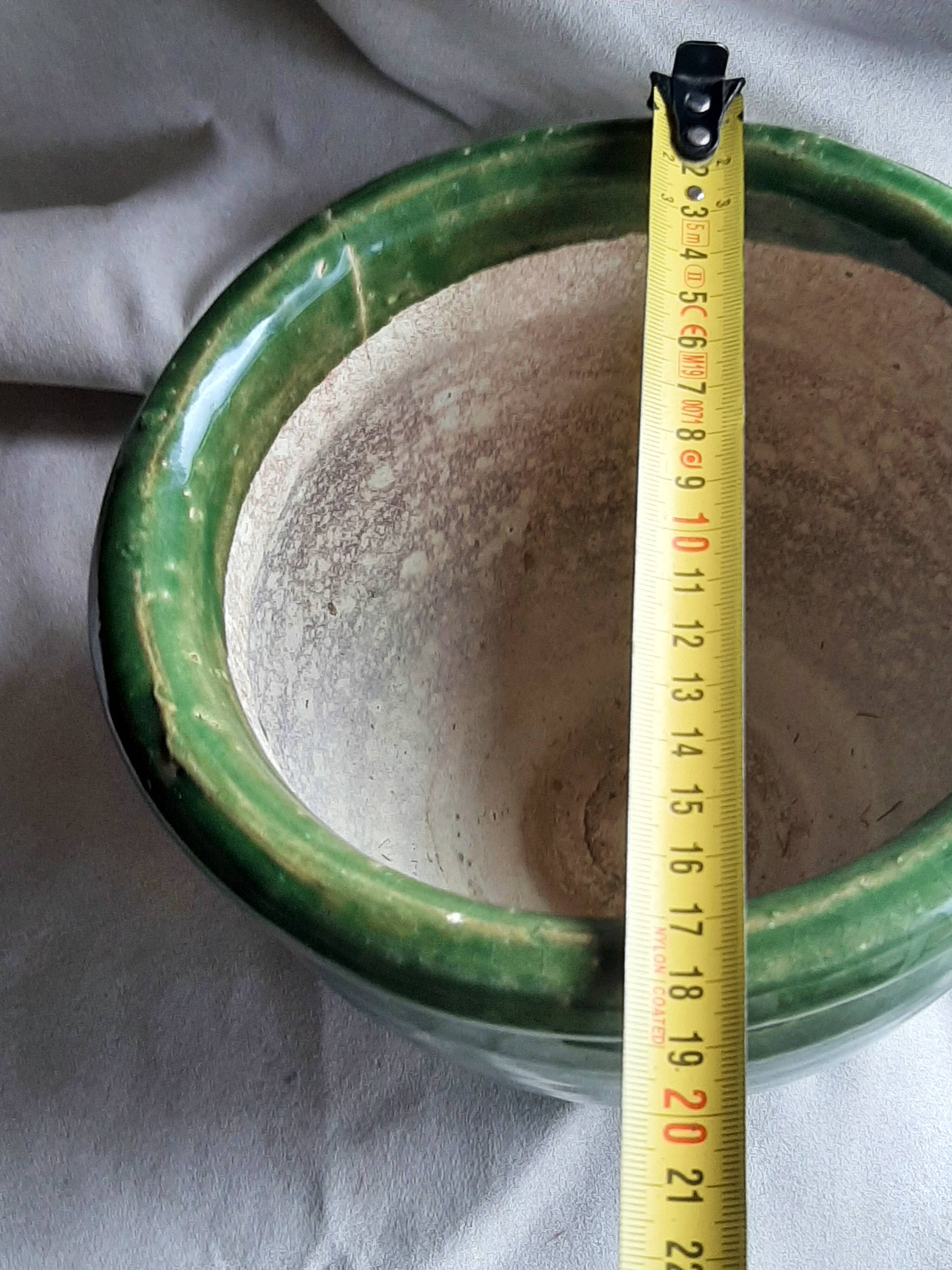 Glazed green terracotta pot.